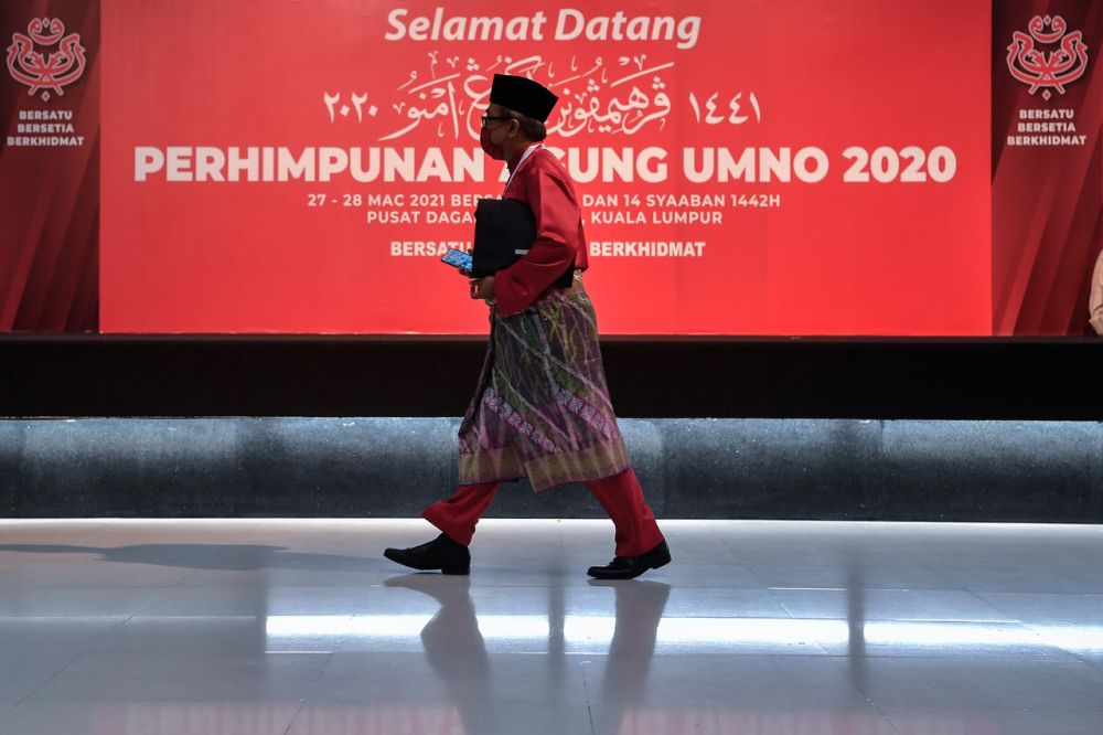 An Umno member arrives for the party's 2020 general assembly in Kuala Lumpur March 28, 2021. u00e2u20acu2022 Bernama pic