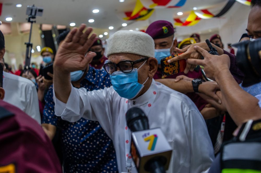 PAS president Datuk Seri Abdul Hadi Awang waves at reporters at  the 2020 Umno general assembly in Kuala Lumpur March 28, 2021. u00e2u20acu201d Picture by Shafwan Zaidon