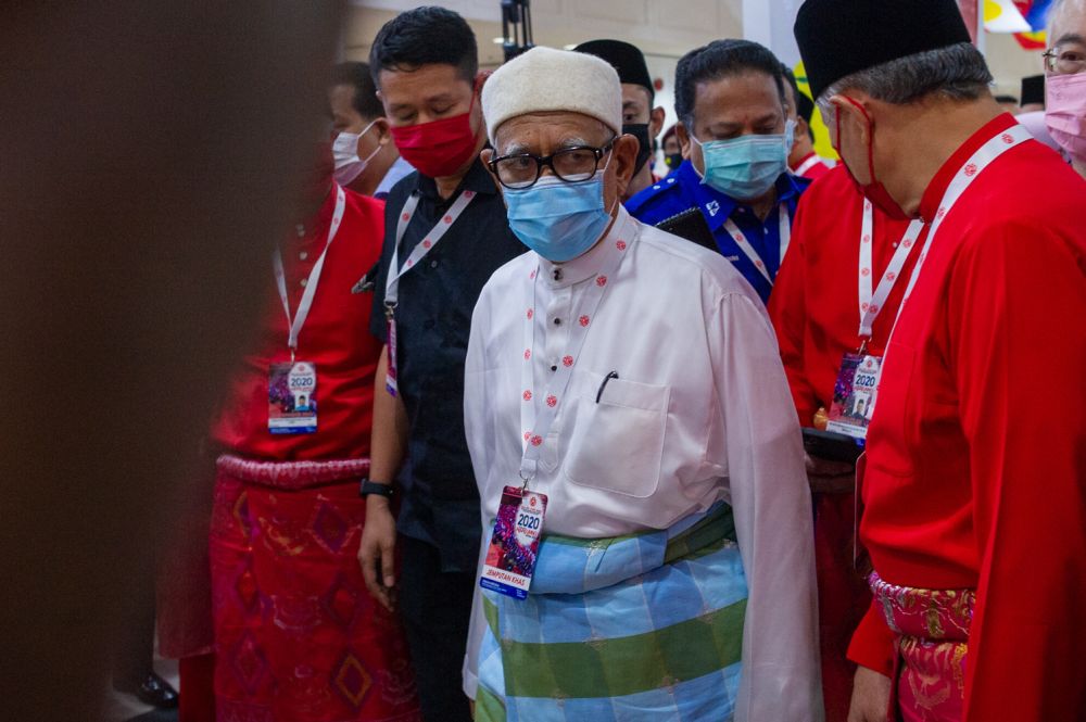 PAS president Datuk Seri Abdul Hadi Awang arrives for the 2020 Umno general assembly in Kuala Lumpur March 28, 2021. u00e2u20acu201d Picture by Shafwan Zaidon