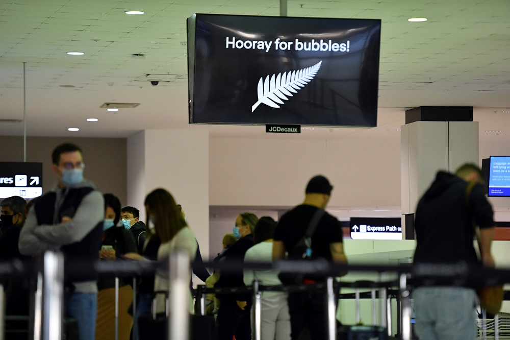 Departure passengers to New Zealand wait to check in, as quarantine-free travel between Australia and New Zealand begins, at Sydney International Airport April 19, 2021. u00e2u20acu201d AAP Image/Mick Tsikas/via Reuters