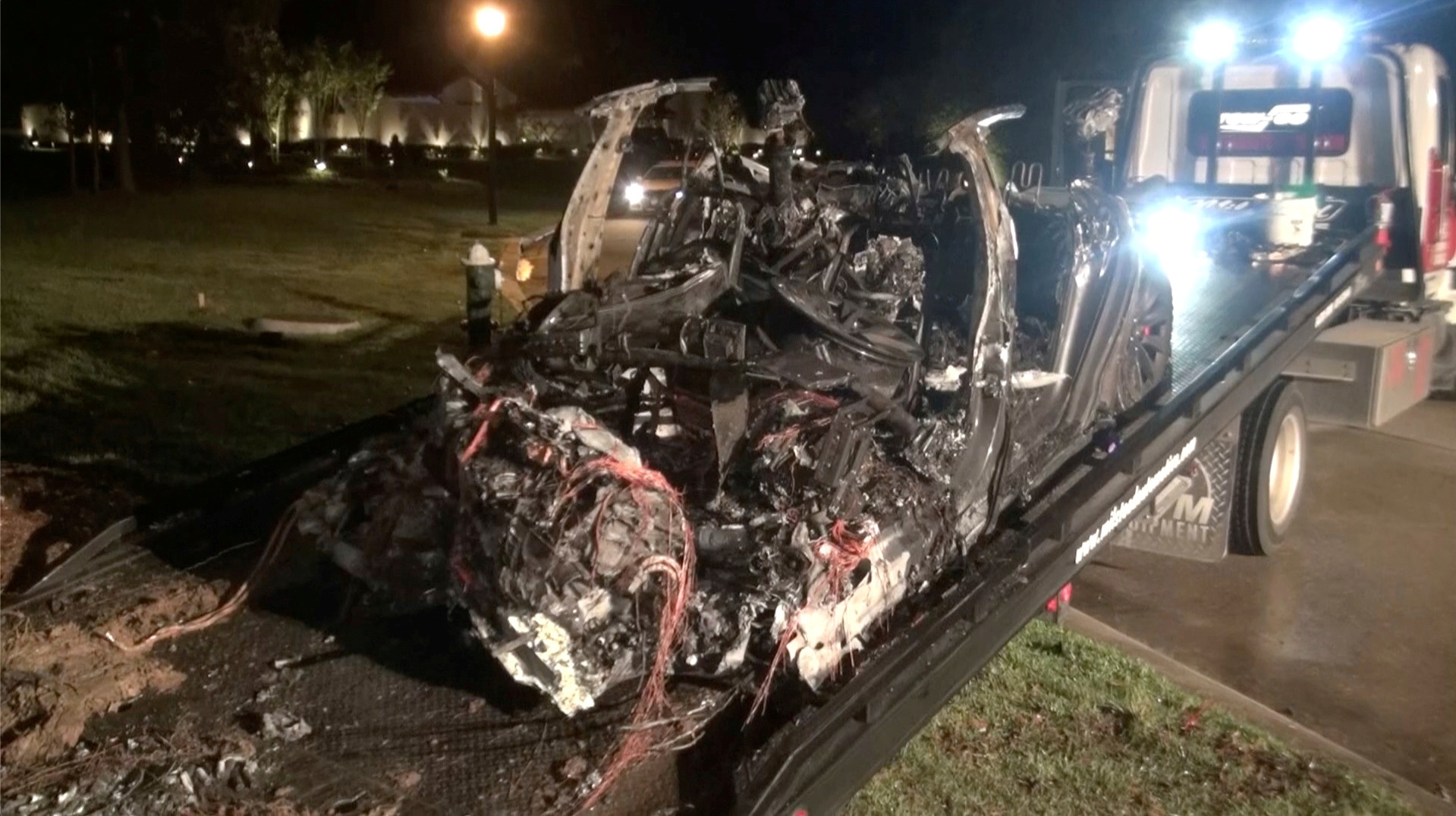 The remains of a Tesla vehicle are seen after it crashed in The Woodlands, Texas, April 17, 2021, in this still image from video obtained via social media. u00e2u20acu201d Screen capture of video by Scott J. Engle via Reuters