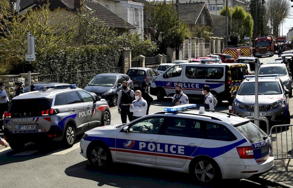 French police officials block off a street near a police station in Rambouillet, south-west of Paris, on April 23, 2021, after a woman was stabbed to death in the town. u00e2u20acu201d AFP pic