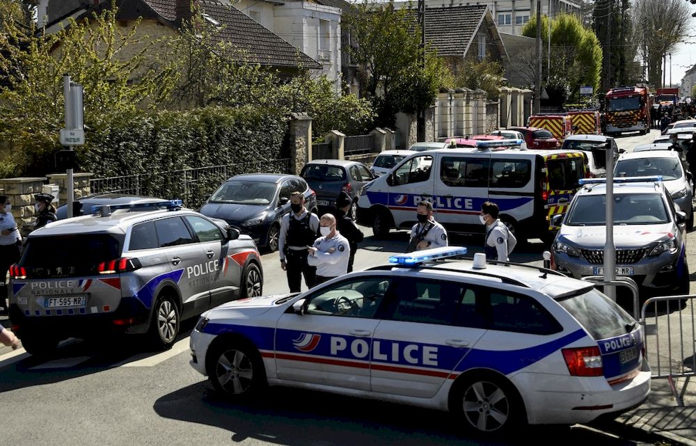 French police officials block off a street near a police station in Rambouillet, south-west of Paris, on April 23, 2021, after a woman was stabbed to death in the town. u00e2u20acu201d AFP pic