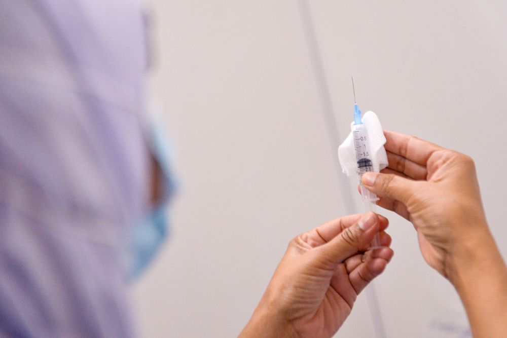 A nurse loads a syringe with a dose Covid-19 vaccine at a vaccination centre in Kapar, Klang April 28, 2021. u00e2u20acu201d Picture by Miera Zulyana