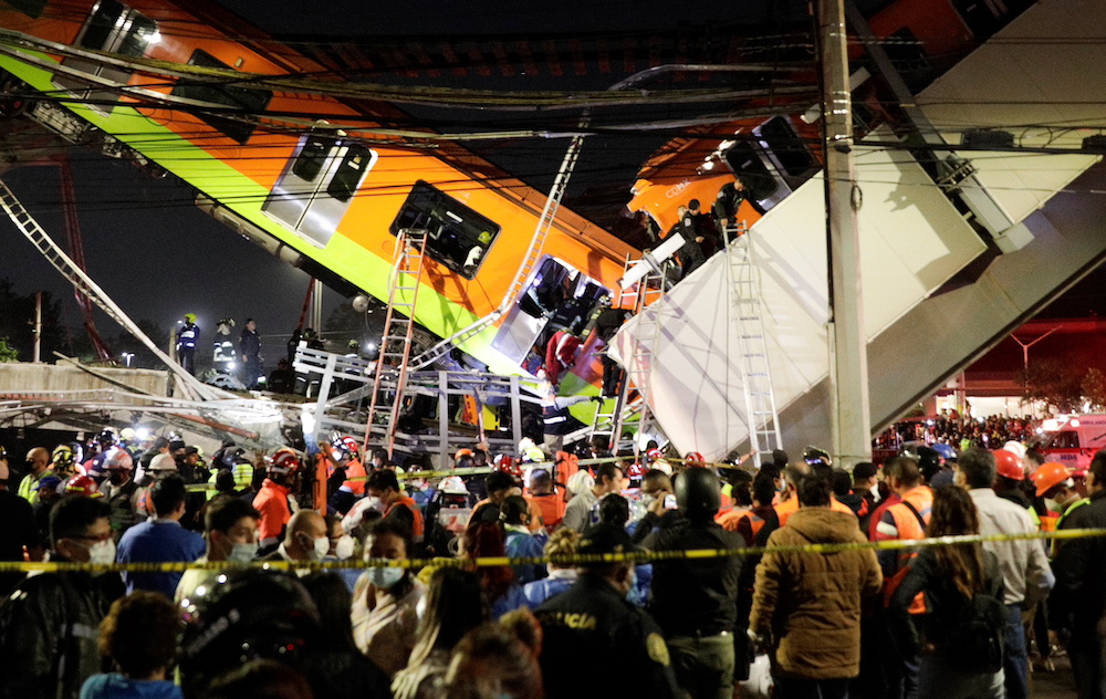 Rescuers work at a site where an overpass for a metro partially collapsed with train cars on it at Olivos station in Mexico City, Mexico May 3, 2021. u00e2u20acu201d Reuters pic