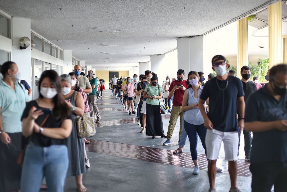 Thousands of people queue up at World Trade Centre to receive their first dose of the AstraZeneca vaccine, May 15, 2021. u00e2u20acu201d Picture by Ahmad Zamzahuri