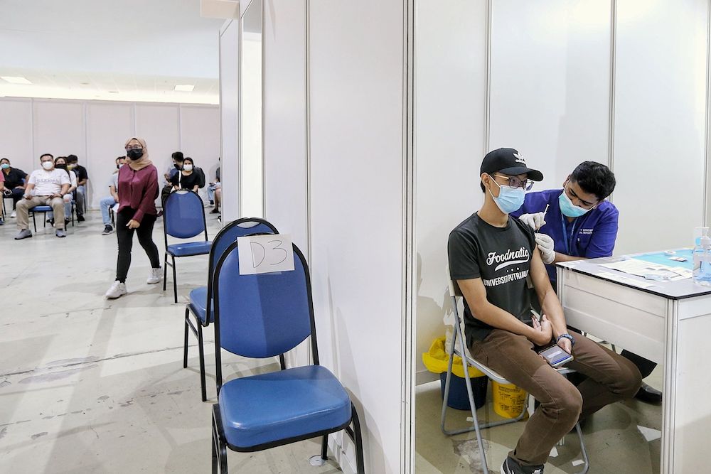 People receive their first dose of the AstraZeneca vaccine at World Trade Centre in Kuala Lumpur May 15, 2021. u00e2u20acu201d Picture by Ahmad Zamzahuri