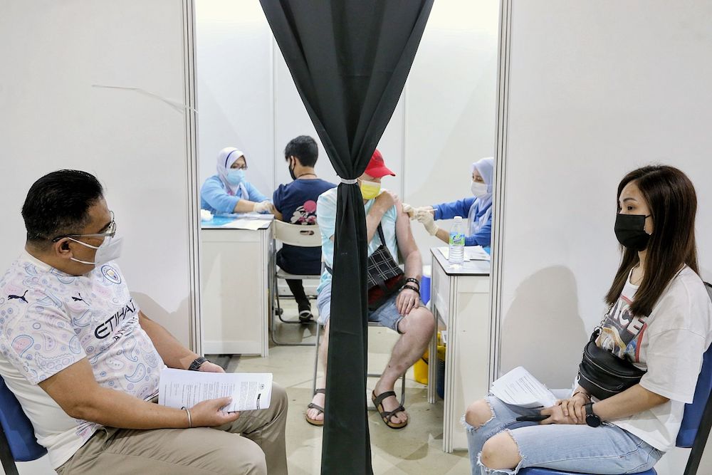 People receive their first dose of the AstraZeneca vaccine at World Trade Centre in Kuala Lumpur May 15, 2021. u00e2u20acu201d Picture by Ahmad Zamzahuri