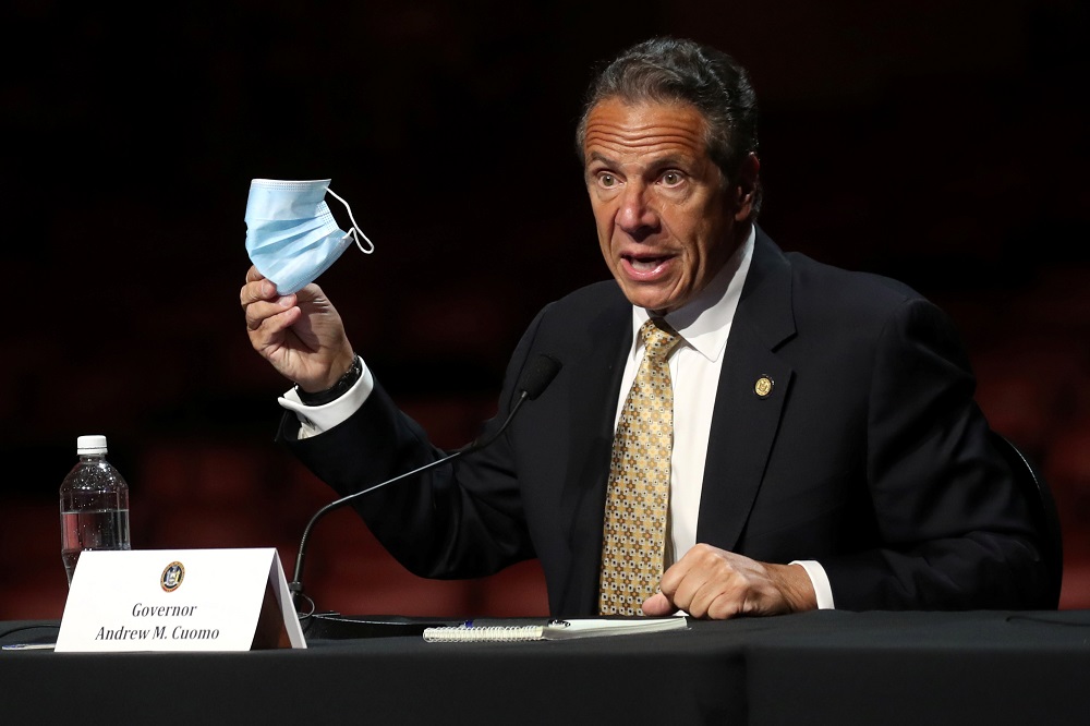 New York Governor Andrew Cuomo holds a protective mask as he speaks while making an announcement at a news conference in New York May 17, 2021. u00e2u20acu201d Reuters pic