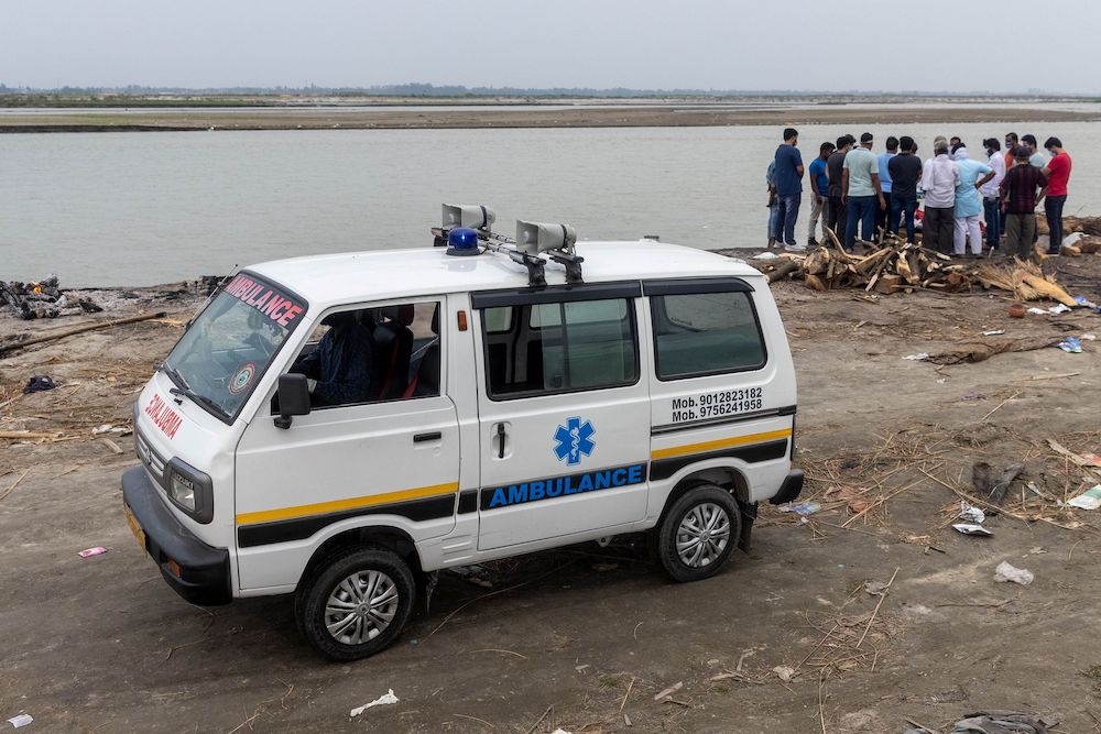 Relatives gather around the body of a man who died from the coronavirus disease (Covid-19), before cremating him on the banks of the river Ganges at Garhmukteshwar in the northern state of Uttar Pradesh, India, May 6, 2021. u00e2u20acu201d Reuters pic 