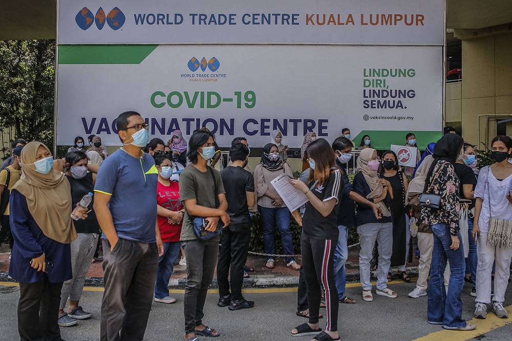 People wait to receive their AstraZeneca Covid-19 vaccine shot at the Vaccine Delivery Centre located at Kuala Lumpur World Trade Centre May 29, 2021. u00e2u20acu201d Picture by Hari Anggara