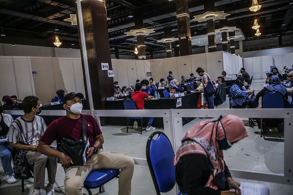People wait to receive their AstraZeneca Covid-19 vaccine shot at the Vaccine Delivery Centre located at Kuala Lumpur World Trade Centre May 29, 2021. u00e2u20acu201d Picture by Hari Anggara