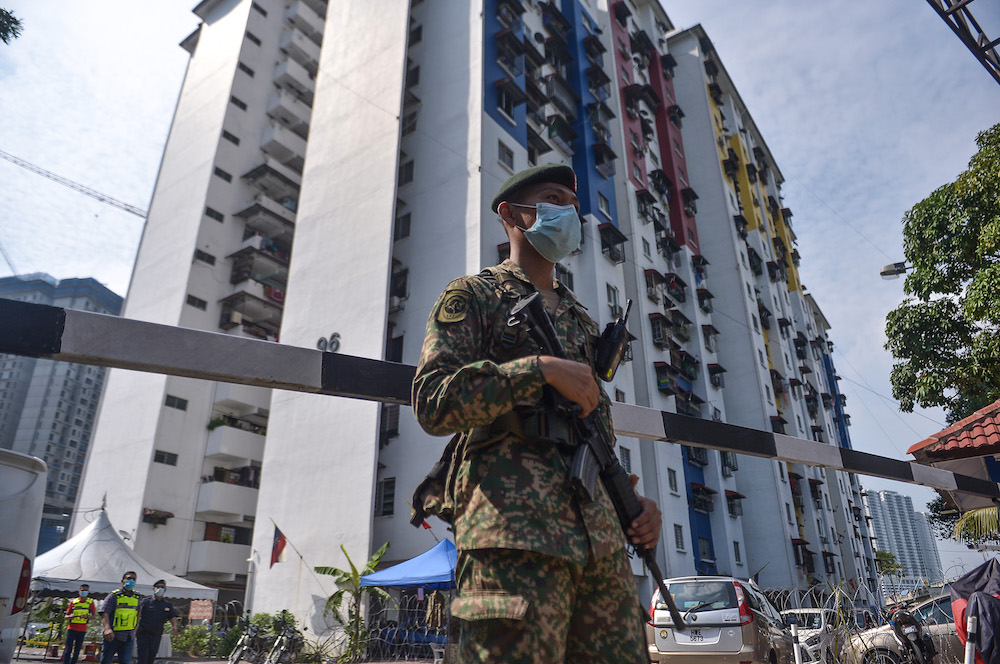 Barbed wire is seen around PPR Kampung Limau in Pantai Dalam after EMCO was imposed on the area, May 23, 2021. u00e2u20acu201d Picture by Miera Zulyana