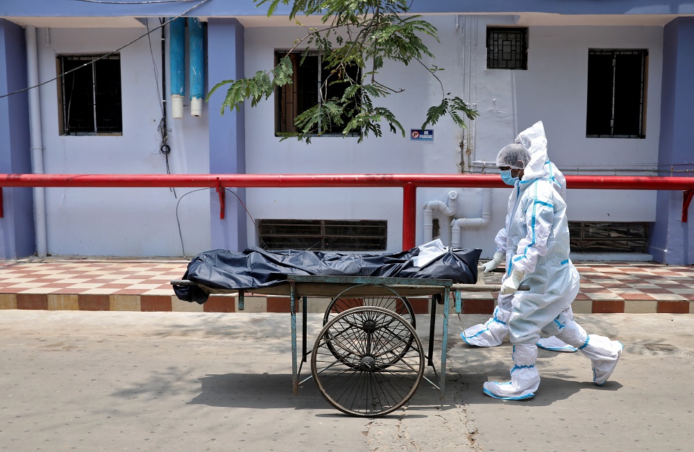 Healthcare workers transfer the body of a person who died from Covid-19 at a hospital in Kolkata, India May 12, 2021. u00e2u20acu2022 Reuters pic