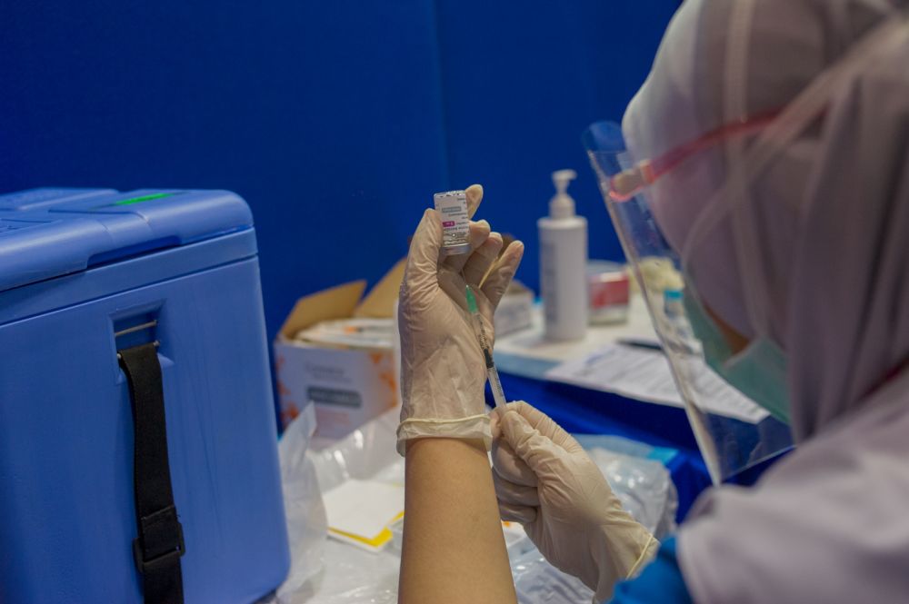 A nurse loads a syringe with a dose of the AstraZeneca Covid-19 vaccine at the Dewan Gemilang UKM vaccination centre in Bangi May 5, 2021. u00e2u20acu201d Picture by Shafwan Zaidon