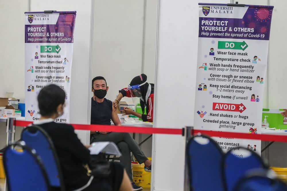 A man receives the AstraZeneca Covid-19 jab at Universiti Malaya, Kuala Lumpur May 5, 2021. u00e2u20acu201d Picture by Yusof Mat Isa