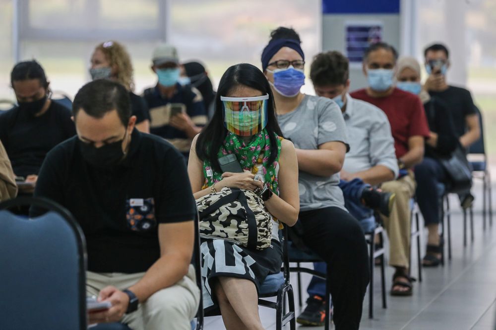 Members of the public wait to receive the AstraZeneca Covid-19 jab at Universiti Malaya, Kuala Lumpur May 5, 2021. u00e2u20acu201d Picture by Yusof Mat Isa