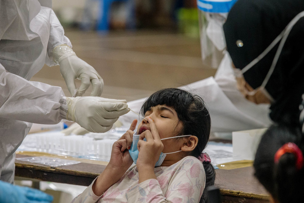 A girl undergoes Covid-19 testing in Ampang May 18, 2021. u00e2u20acu201d Picture by Firdaus Latif