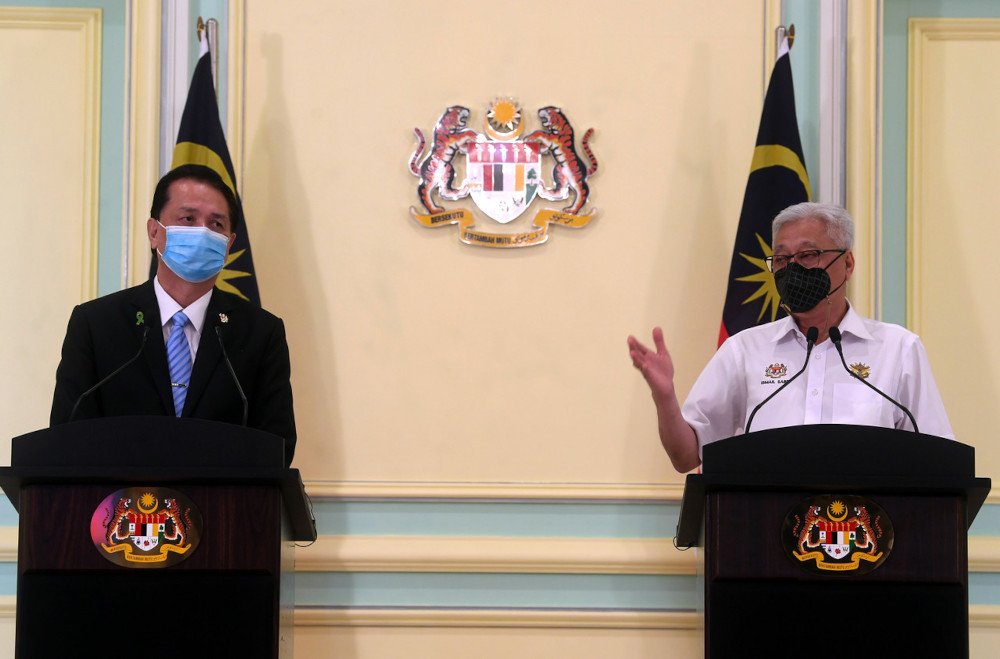 Senior Minister (Security Cluster) Datuk Seri Ismail Sabri Yaakob and Health director-general Tan Sri Dr Noor Hisham Abdullah during a joint press conference at the Perdana Putra building in Putrajaya, May 11, 2021. u00e2u20acu201d Bernama pic