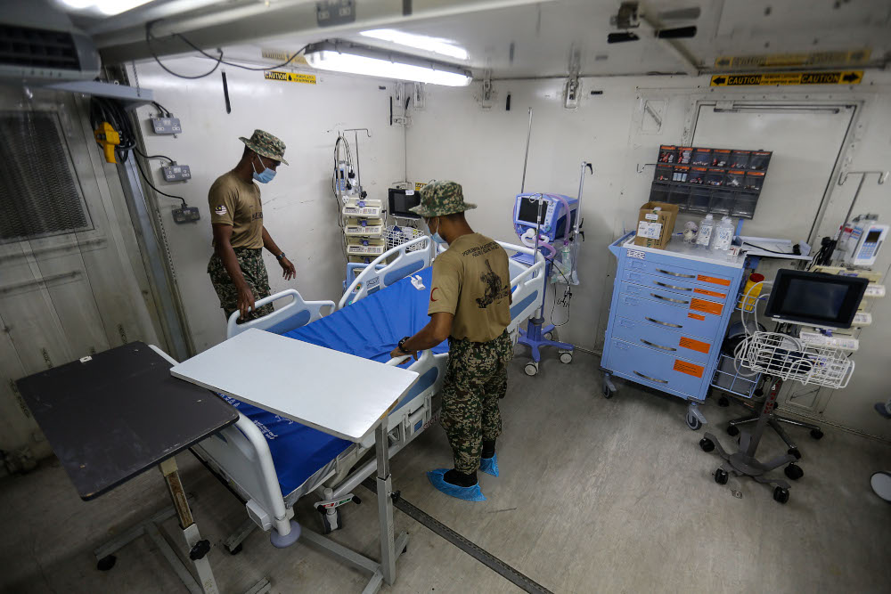 Royal Malaysian Army personnel arranging the bed in the Field ICU to combat the surge of Covid-19 cases here at Kepala Batas Hospital, May 21, 2021. u00e2u20acu201d Picture by Sayuti Zainudin