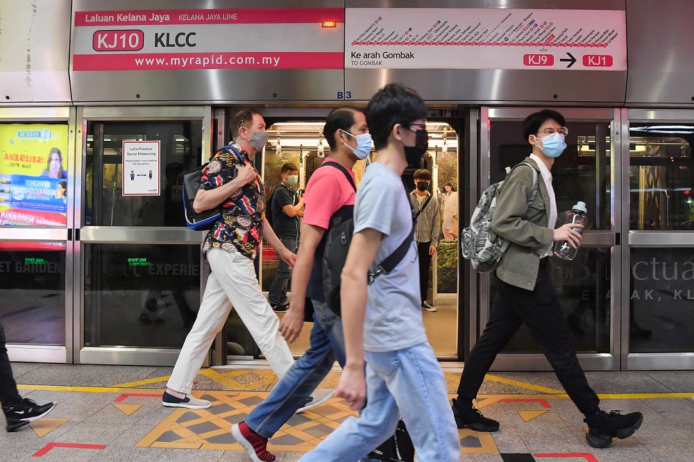 Commuters are seen walking along the platform of the KLCC LRT station in Kuala Lumpur May 25, 2021. u00e2u20acu2022 Bernama pic