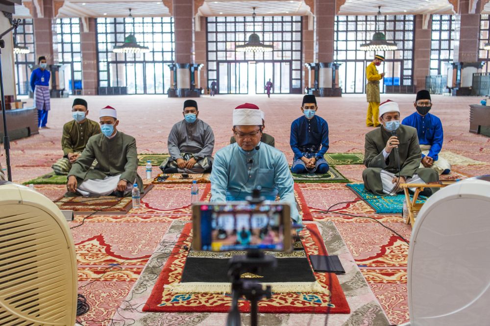 Muslims observe social distancing while performing Aidilfitri prayers at Masjid Putra, in Putrajaya, on the first day of Raya May 13, 2021. u00e2u20acu201d Picture by Shafwan Zaidon
