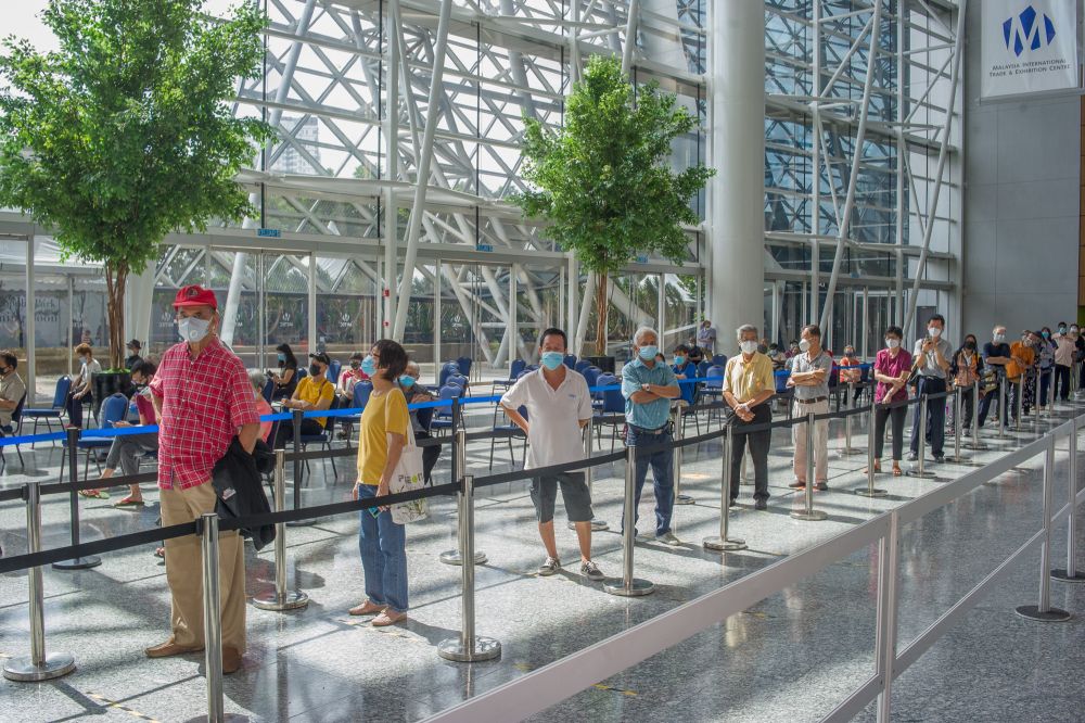 People wait in line to receive their Covid-19 jab at the Malaysia International Trade and Exhibition Centre in Kuala Lumpur May 31, 2021. u00e2u20acu201d  Picture by Shafwan Zaidon