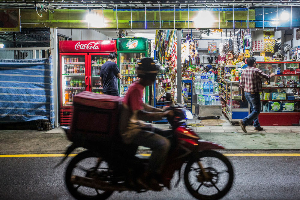 Traders in Kuala Lumpur at the end of the first day of tightened MCO 3.0 SOPs which came into effect May 25, 2021, allowing businesses to operate from 8am to 8pm. u00e2u20acu2022 Picture by Hari Anggara