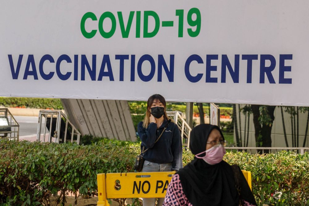 People queue outside the World Trade Centre Kuala Lumpur as they wait to receive the AstraZeneca Covid jab May 16, 2021. u00e2u20acu2022 Picture by Firdaus Latifnnn