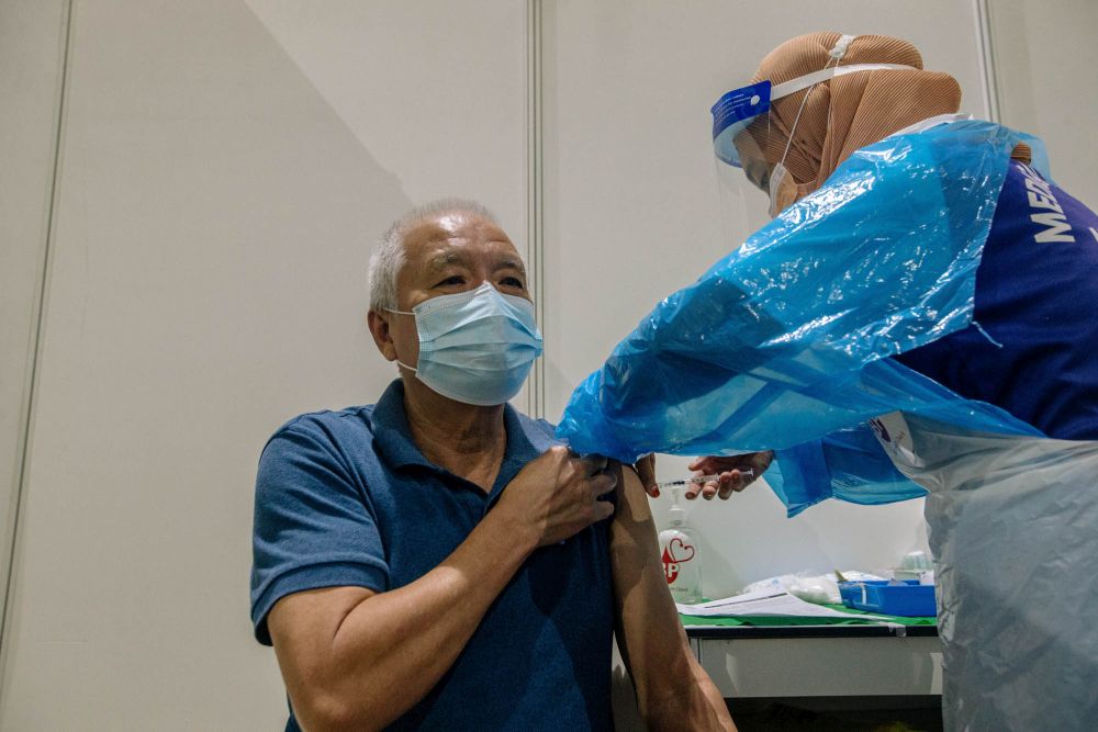 A nurse administers a dose of the AstraZeneca Covid-19 vaccine at the World Trade Centre Kuala Lumpur vaccination centre May 16, 2021. u00e2u20acu201d Picture by Firdaus Latif