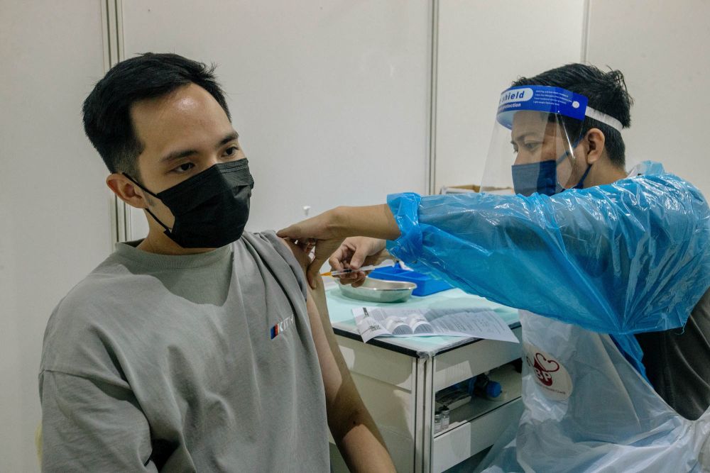 A nurse administers a dose of the AstraZeneca Covid-19 vaccine at the World Trade Centre Kuala Lumpur vaccination centre May 16, 2021. u00e2u20acu201d Picture by Firdaus Latif