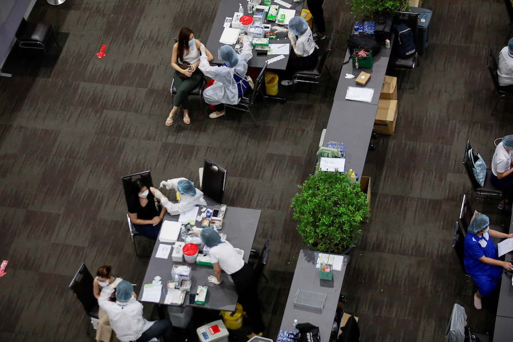 People receive the first dose of the AstraZeneca Covid-19 as Thailand start a mass inoculation at a gymnasium inside the Siam paragon Shopping center, Bangkok, Thailand June 7, 2021. u00e2u20acu201d Reuters pic