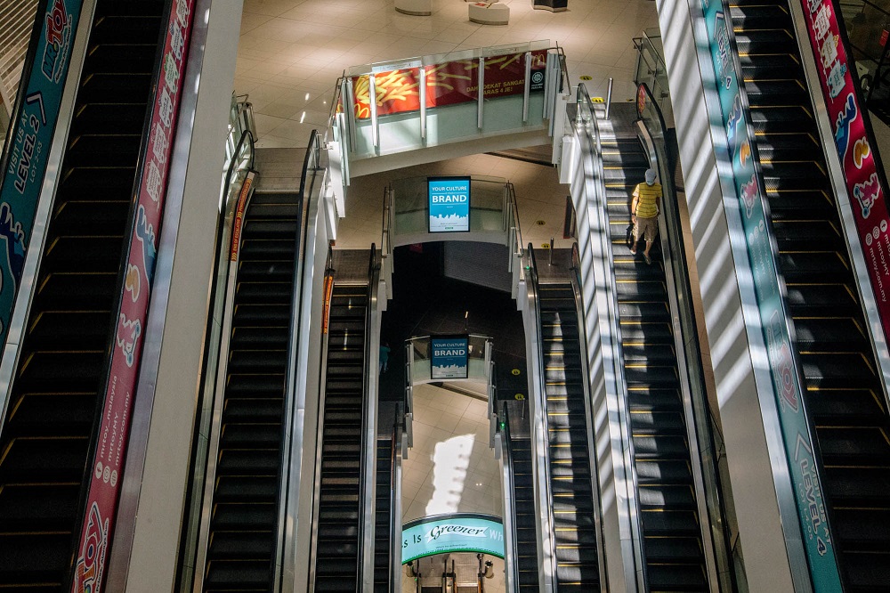 A visitor takes the escalator at to the NU Sentral shopping mall in Kuala Lumpur June 2, 2021. u00e2u20acu201d Picture by Firdaus Latif