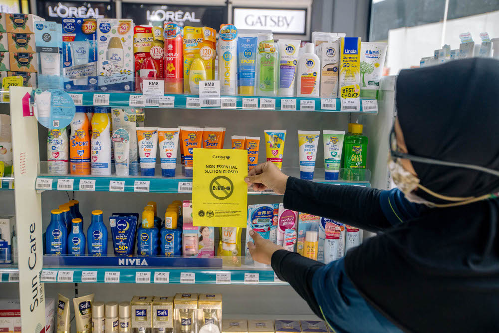 A section of a Caring pharmacy is seen in Kuala Lumpur June 4, 2021. The non-essential sections which selling hair colours, suncare, facial masks and menu00e2u20acu2122s hair gel are closed due to the Full Movement Control Order (FMCO). u00e2u20acu201d Picture by Firdaus Latif