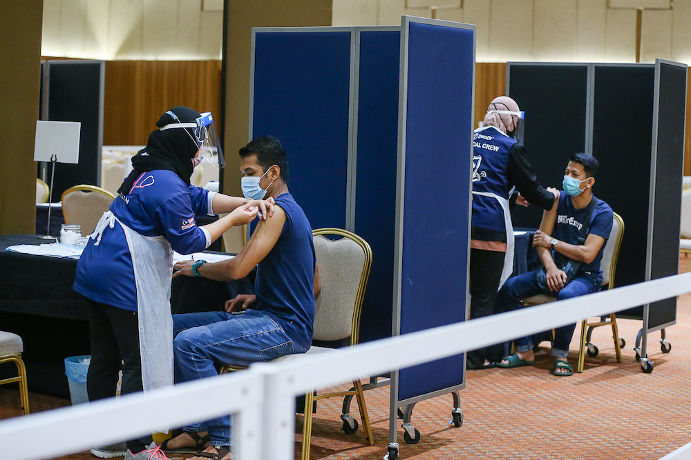 Manufacturing workers in Selangor receive their Pikas Covid-19 jab at the vaccination centre at Setia City Convention Centre in Shah Alam June 28, 2021. u00e2u20acu201d Picture by Yusof Mat Isa