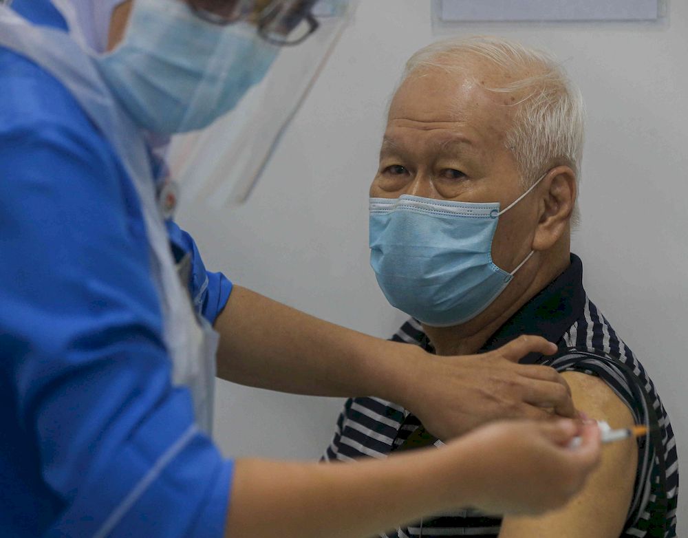 The second phase of vaccination under the National Immunisation Programme going smoothly according to schedule at the vaccination centre (PPV) Stadium Indera Mulia in Ipoh, Perak on June 4, 2021. u00e2u20acu201d Picture by Farhan Najib
