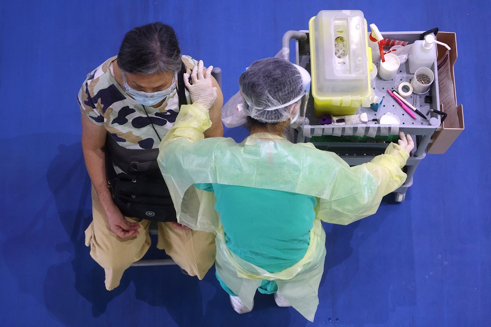 A medical worker administers a dose of the AstraZeneca vaccine to a woman during a vaccination session for elderly people over 75 years old, at a stadium in New Taipei City, Taiwan June 25, 2021. u00e2u20acu2022 Reuters pic