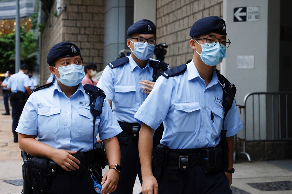 Police stand guards as a prison van arrive High Court on the first day of trial of Tong Ying-kit, the first person charged under a new national security law, in Hong Kong, China June 23, 2021. u00e2u20acu2022 Reuters pic 