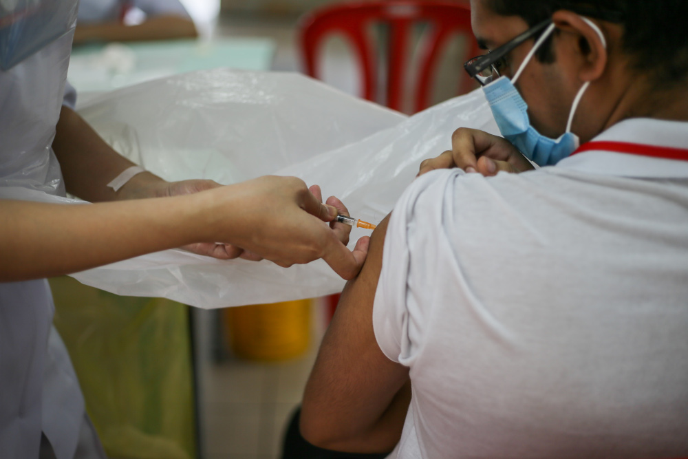 Staff and residents of Rumah Amal Cheshire receive the Covid 19 vaccine jab at Rumah Amal Cheshire Selangor, June 24, 2021. u00e2u20acu201d Picture by Ahmad Zamzahuri