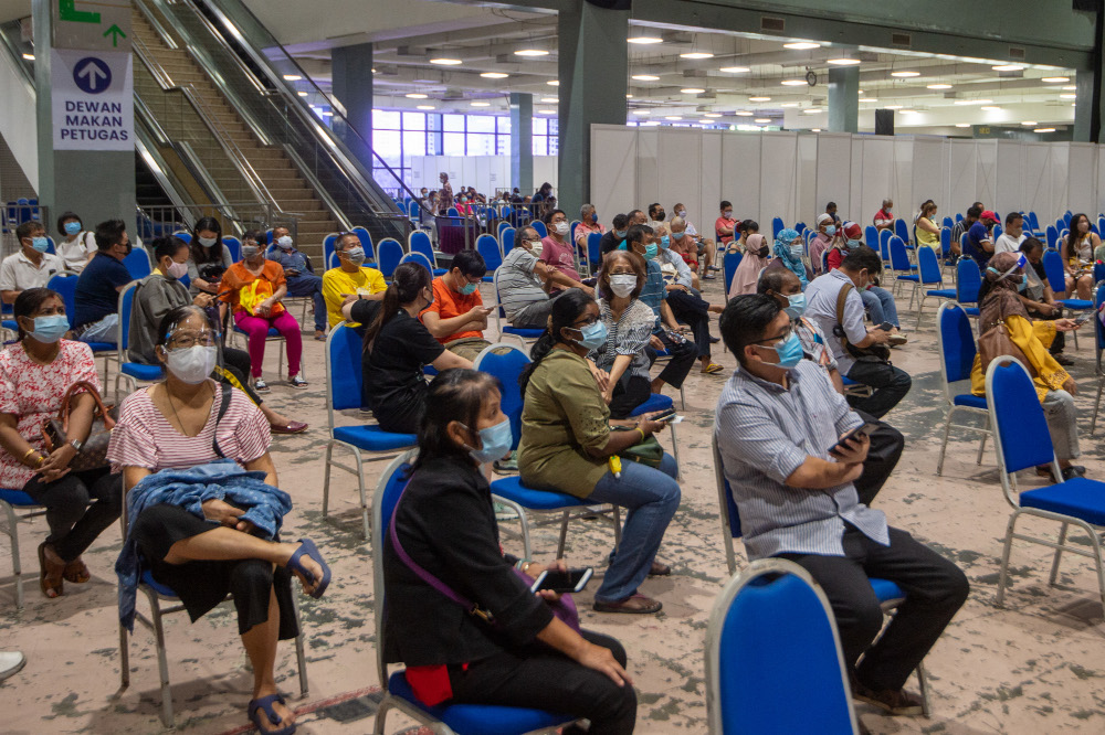 People wait to receive their Covid-19 vaccines at the Covid-19 vaccination centre in the Mines International Exhibition and Convention Centre, Seri Kembangan, June 17, 2021. u00e2u20acu201d Picture by Shafwan Zaidon