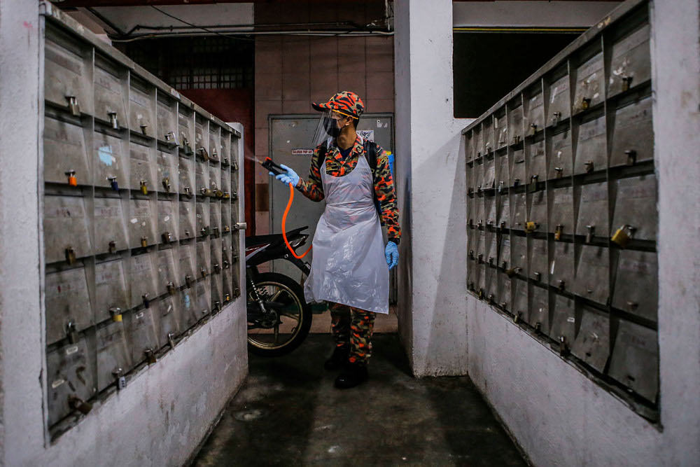 Kuala Lumpur Fire and Rescue personnel conduct a sanitisation operation at Perkasa Peopleu00e2u20acu2122s Housing Project (PPR) in Kuala Lumpur, June 3, 2021. u00e2u20acu2022 Picture by Hari Anggara