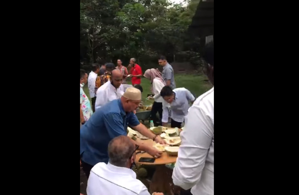 A screengrab of the alleged durian feast attended by Batu Pahat MP Datuk Mohd Rashid Hasnon during lockdown in Johor recently. u00e2u20acu201d Screengrab via Facebook