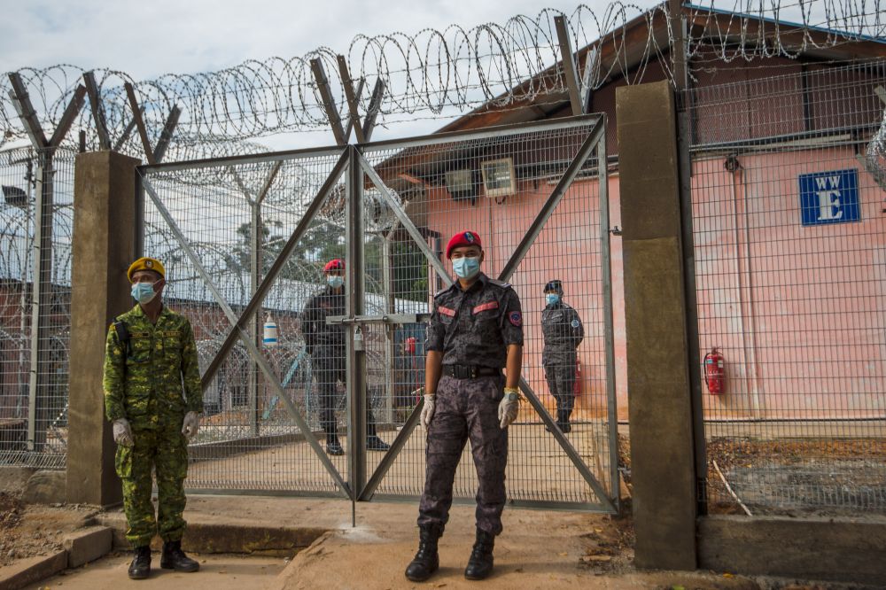 Officers are seen guarding the Temporary Millennium Beranang Immigration Depot in Beranang June 3, 2021. u00e2u20acu201d Picture by Shafwan Zaidonnn