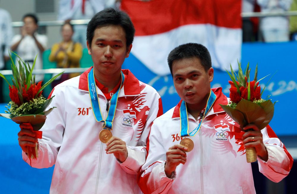 马基斯（右）搭档亨德拉拿下无数世界顶级大赛男双冠军，包括世锦赛、奥运会和这张拍摄的2010年广州亚运会。-路透社-