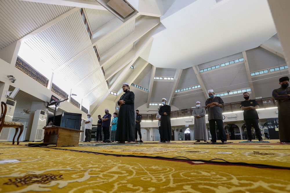 Muslims observe MCO SOPs during Friday prayers at the Al-Malik Khalid Mosque in Universiti Sains Malaysia, Penang June 4, 2021. u00e2u20acu201d Picture by Sayuti Zainudin