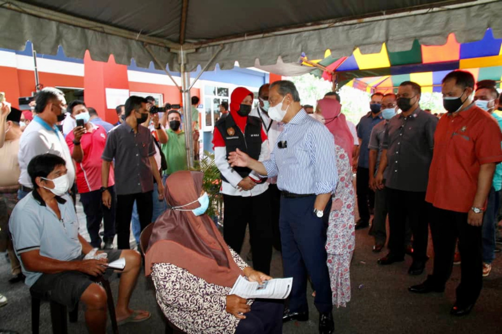 Prime Minister Tan Sri Muhyiddin Yassin during his visit to the Dewan Muafakat Bukit Gambir PPV in Johor, June 22, 2021. u00e2u20acu201d Picture by Ben Tann