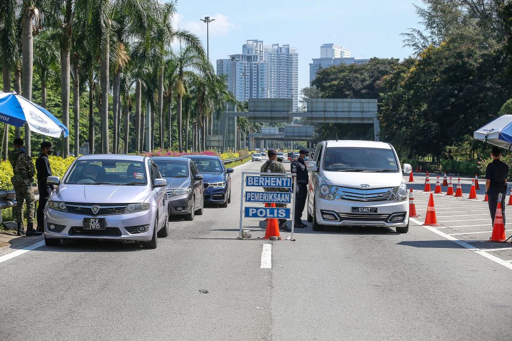 Police and Armed Forces personnel conduct checks on vehicles at a roadblock on the Tun Dr Lim Chong Eu Expressway June 1, 2021. u00e2u20acu201d Picture by Sayuti Zainudin