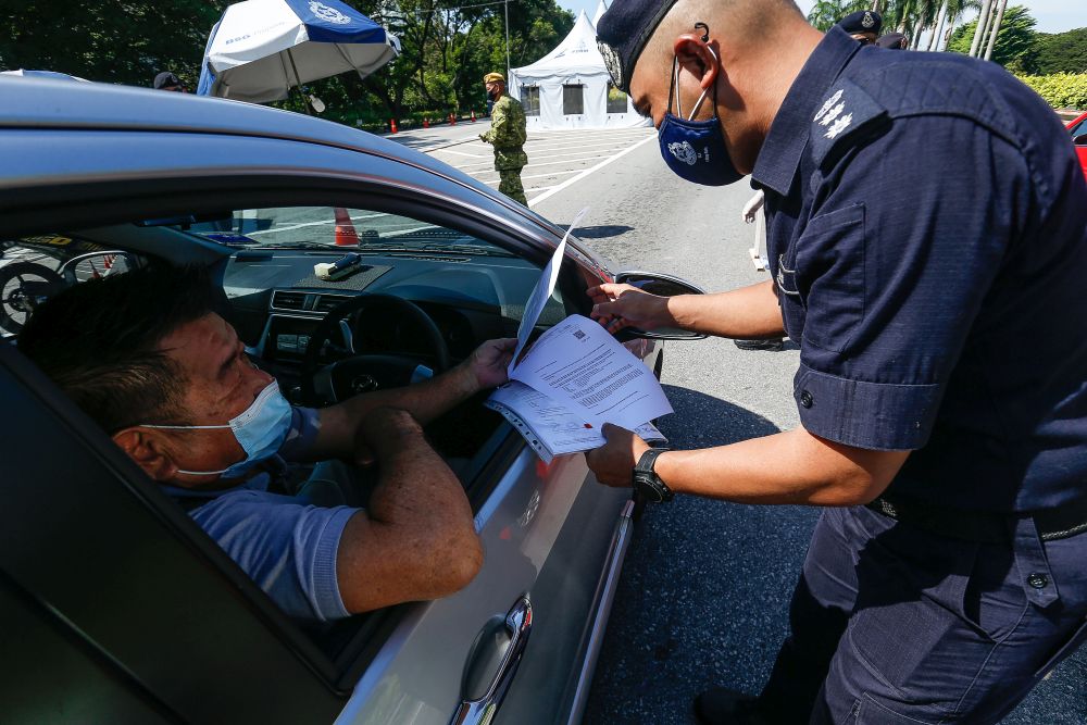 Penang Northeast District police chief Assistant Commissioner Soffian Santong conducts checks on vehicles at a roadblock on the Tun Dr Lim Chong Eu Expressway June 1, 2021. u00e2u20acu201d Picture by Sayuti Zainudin