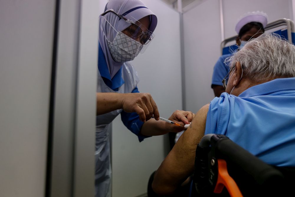 A nurse administers a dose of the Covid-19 vaccine at Pesta Penang, Bayan Lepas June 8, 2021. u00e2u20acu201d Picture by Sayuti Zainudin