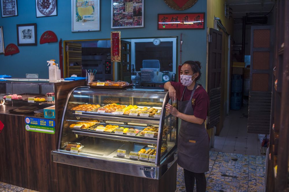 Ban Jun Jia, an employee at Fung Wong Biscuits, a bakery selling traditional Chinese pastries and founded over 100 years ago, speaks to Malay Mail during an interview in Kuala Lumpur June 23, 2021. u00e2u20acu201d Picture by Shafwan Zaidonnn